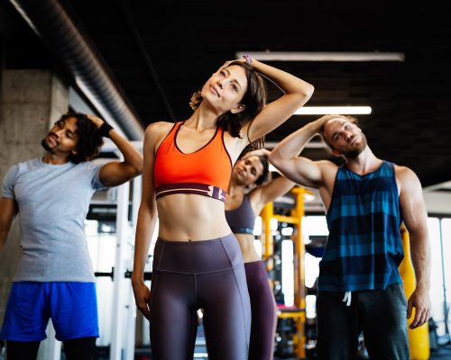 beautiful-fit-people-working-out-in-gym-together-QZRHWG8-min.jpg
