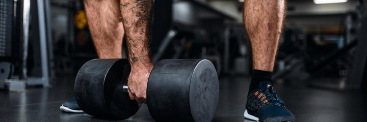 male-person-with-dumbbell-training-in-gym-37LACSK-min.jpg